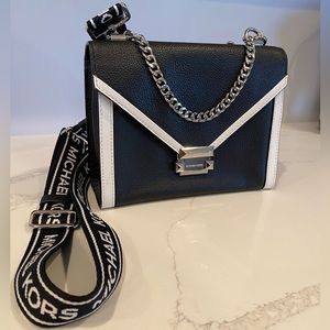 Michael Kora black and white crossbody bag with logo strap